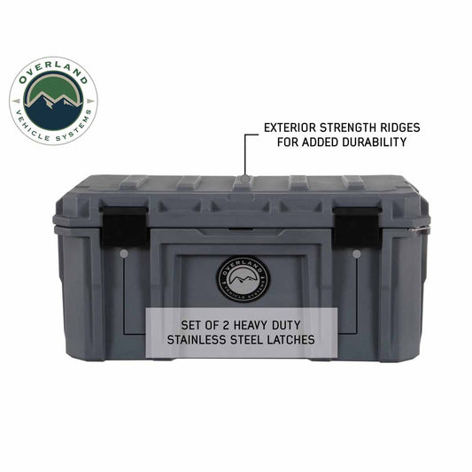Gray storage box with Overland Vehicle Systems branding and text about durability features on a white background.