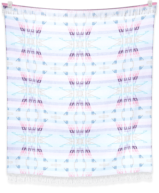 Colorful patterned blanket with fringes on a black background