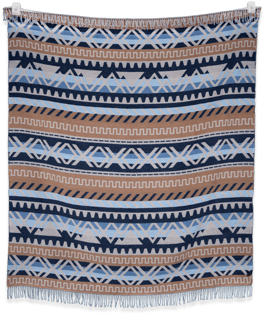 Blanket with geometric pattern in blue, brown, and white on a black background