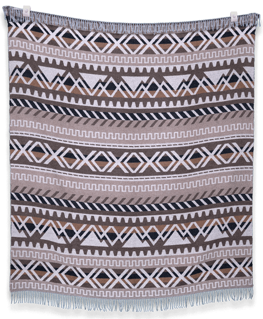 Woven blanket with geometric pattern on a plain background