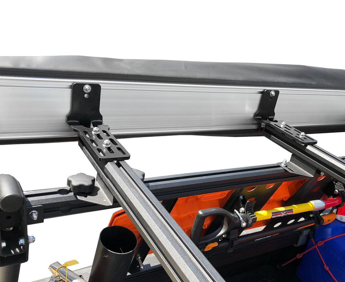 Close-up of a awning system on a vehicle with tools inside.
