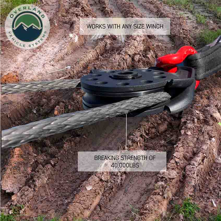 Winch cable system with pulley system on a dirt background, featuring Overland Vehicle Systems logo.
