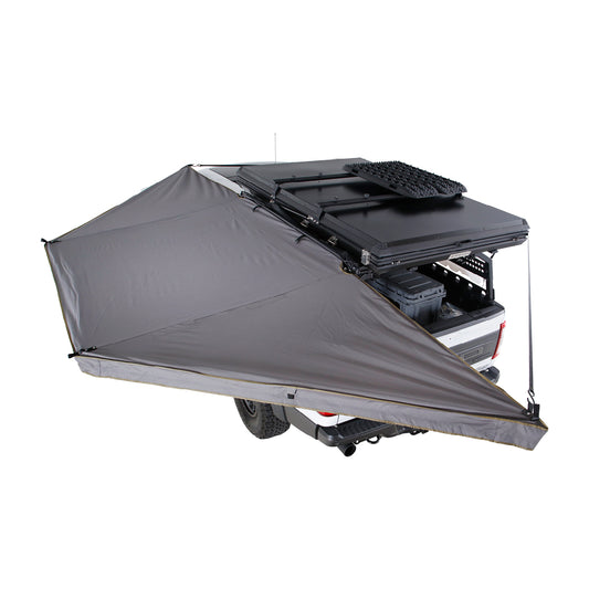 Gray rooftop tent attached to a vehicle on a white background