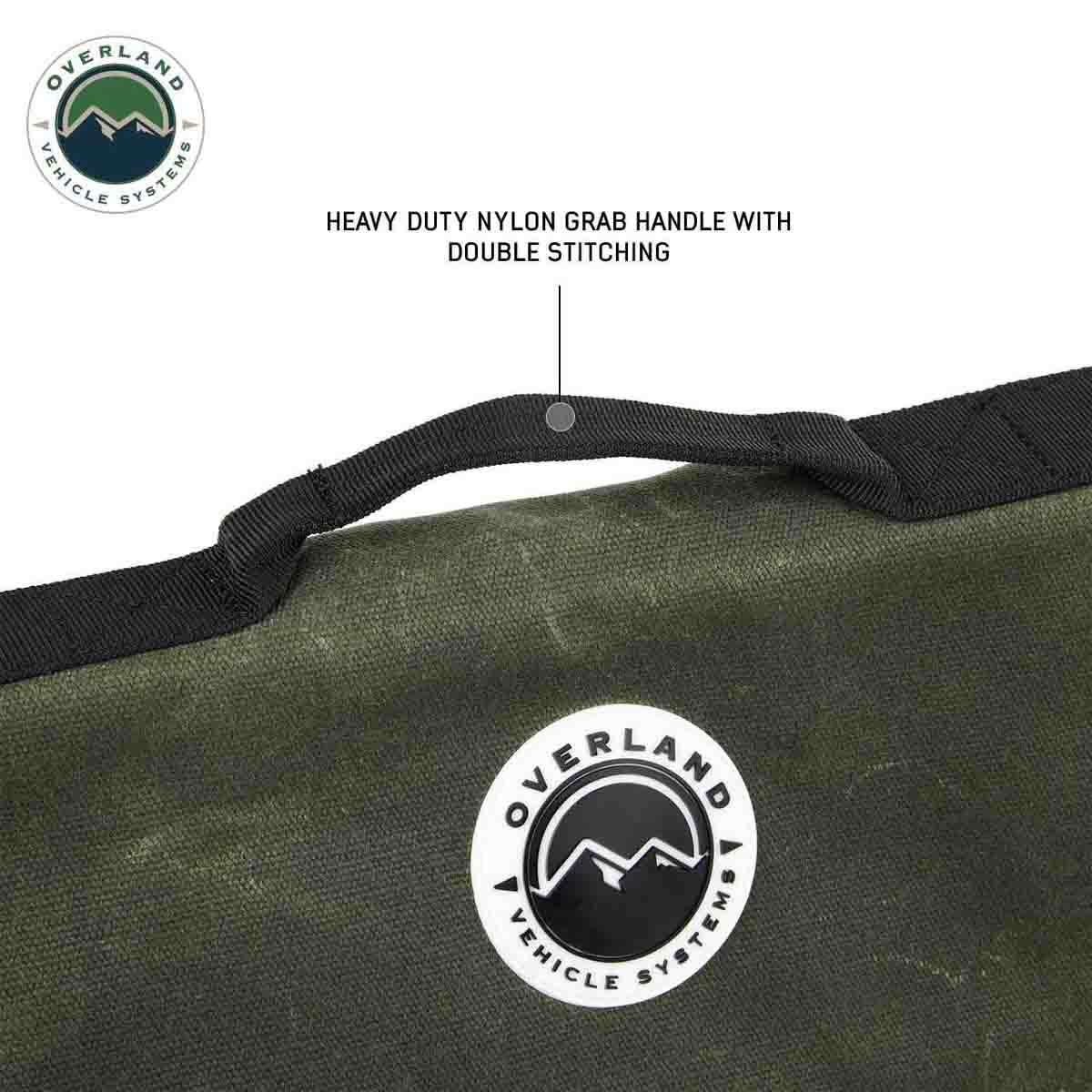 Green bag with a heavy-duty nylon grab handle and double stitching, featuring Overland Vehicle Systems logo.