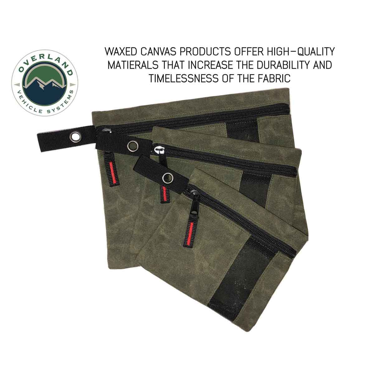 Waxed canvas bags with black zippers on a white background, featuring Overland Vehicle Systems logo.