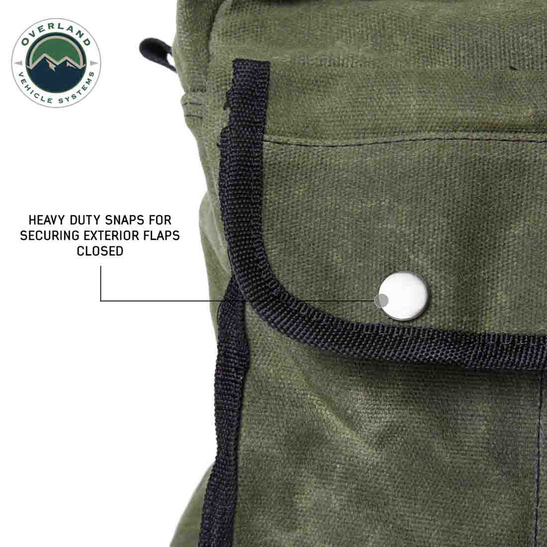 Green bag with heavy-duty snaps for securing exterior flaps, featuring Overland Vehicle Systems logo.