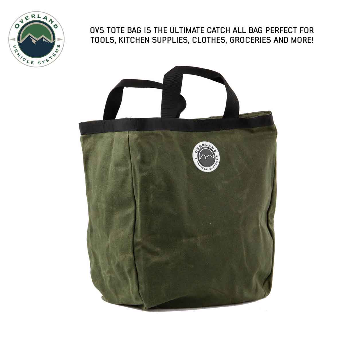 Green tote bag with black handles on a white background, featuring Overland Vehicle Systems logo.