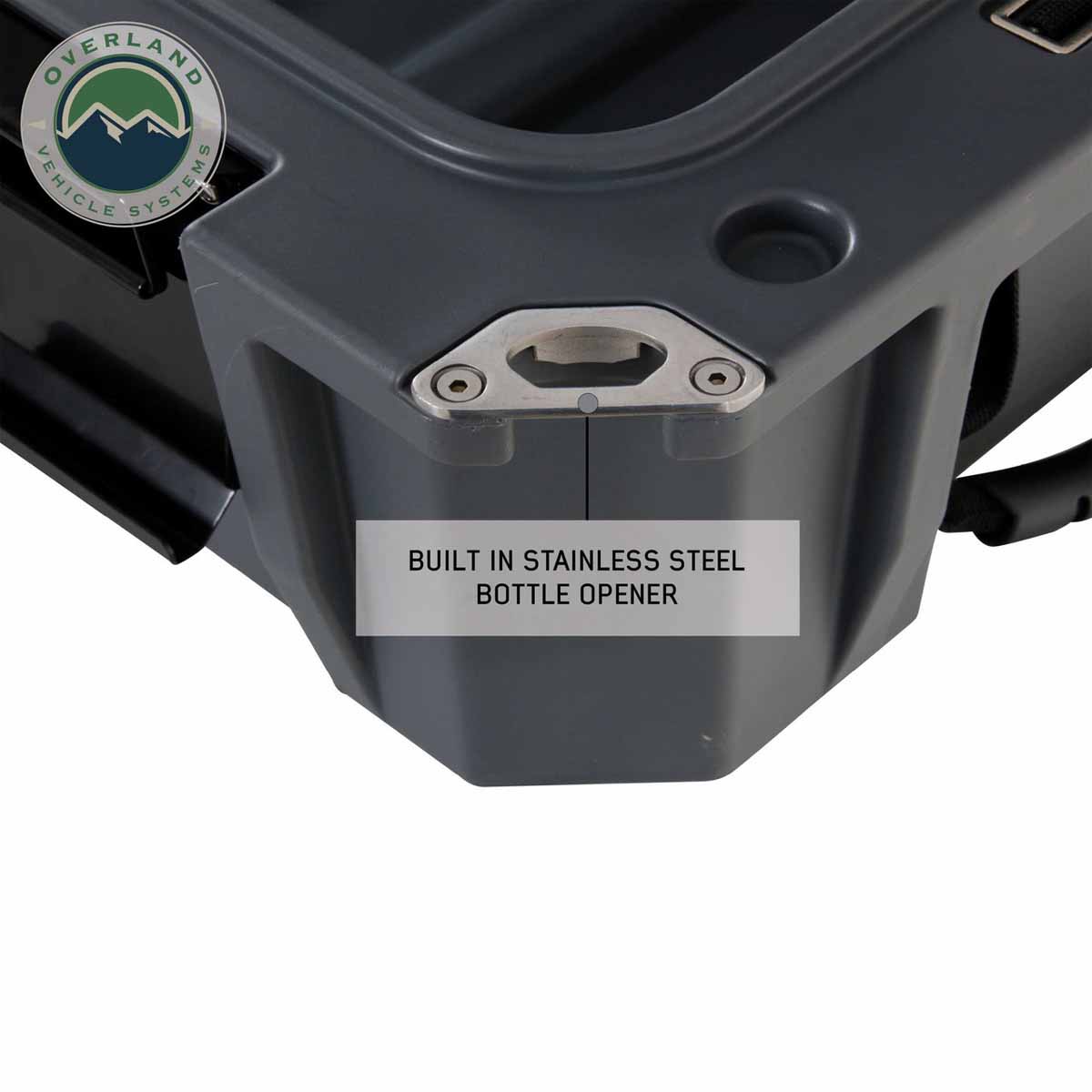 Close-up of a gray container with a stainless steel bottle opener feature, featuring Overland Vehicle Storage logo.