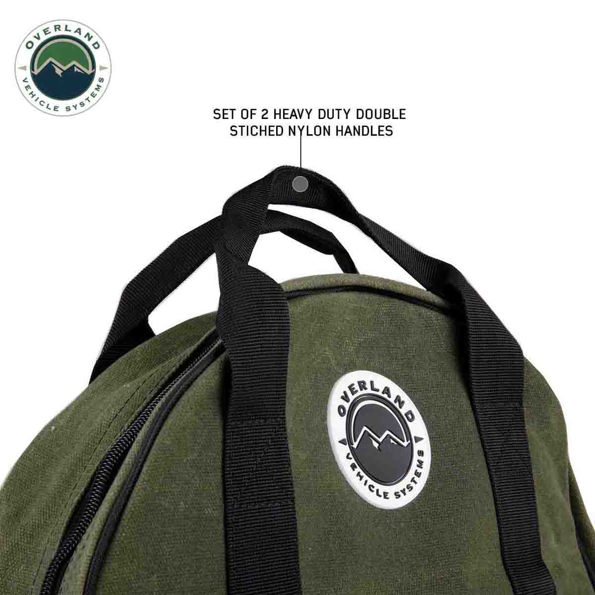 Green bag with black handles and Overland Vehicle Systems logo on a white background