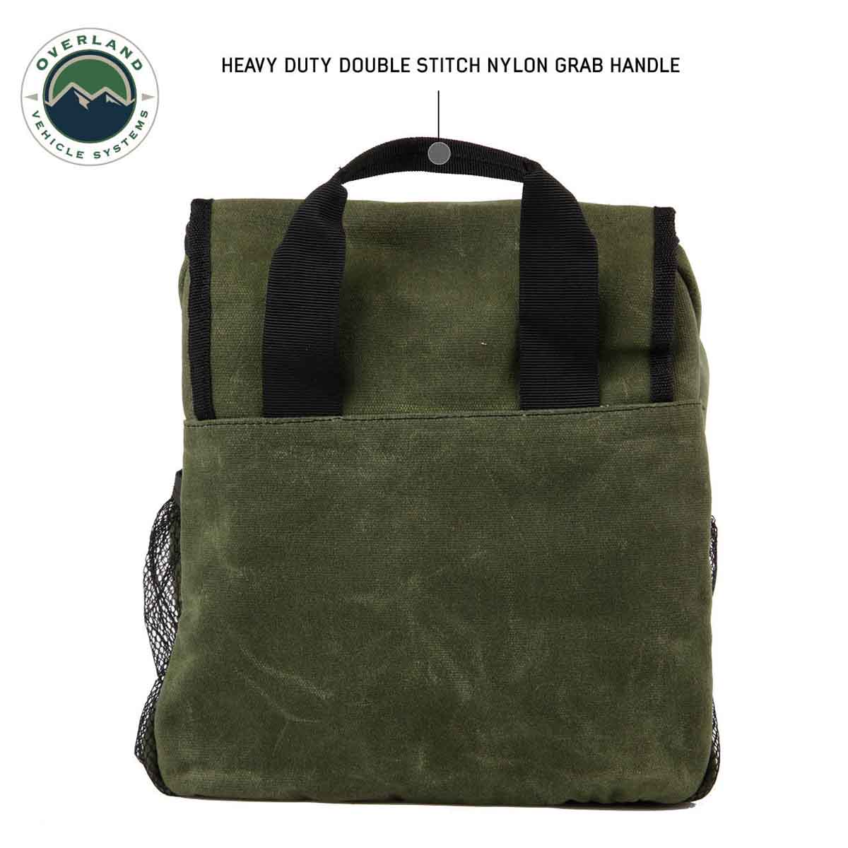 Green overnight bag with black handles on a white background, featuring Overland Vehicle Systems logo.