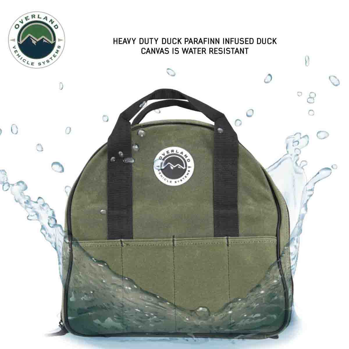 Green bag with black straps on a white background with water splashes, featuring Overland Vehicle Systems logo.