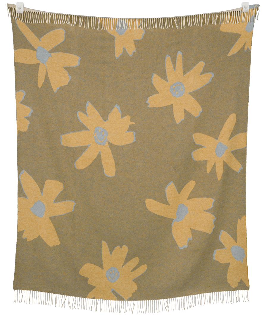 Floral patterned throw blanket with yellow flowers on a brown background