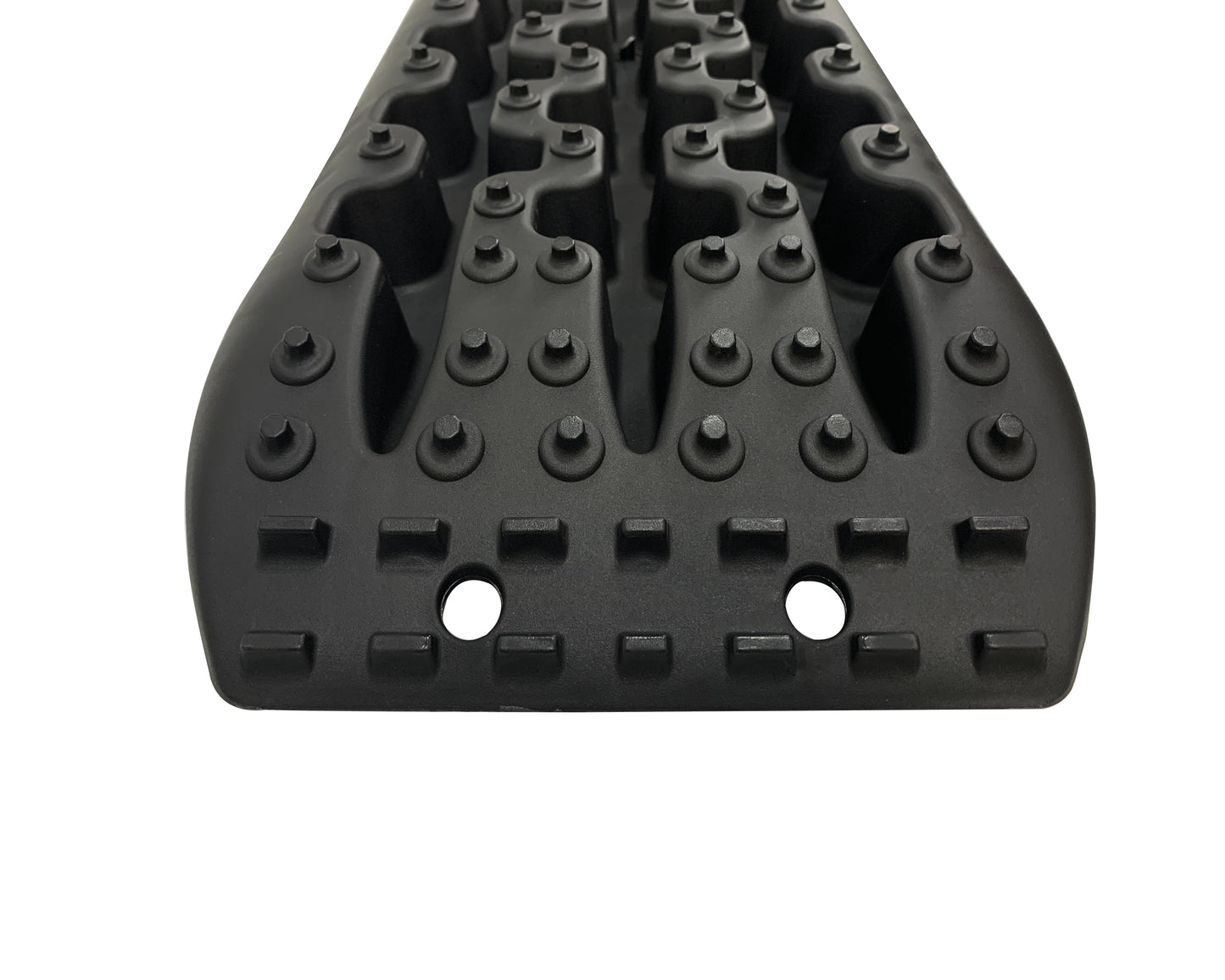 Black rubber mat with textured surface on a white background