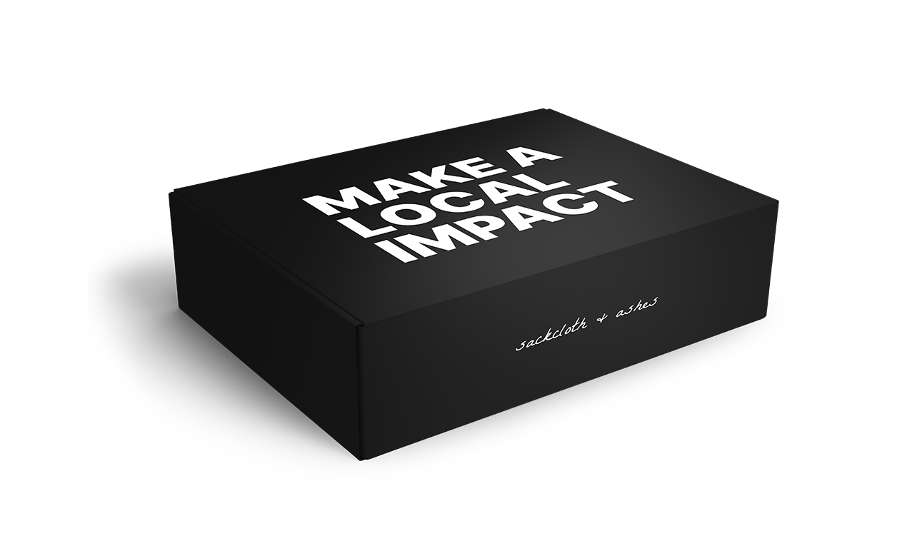 Black box with 'MAKE A LOCAL IMPACT' text on a white background