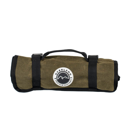 Green roll-up bag with black straps and Overland  Vehicle Systems logo on a white background