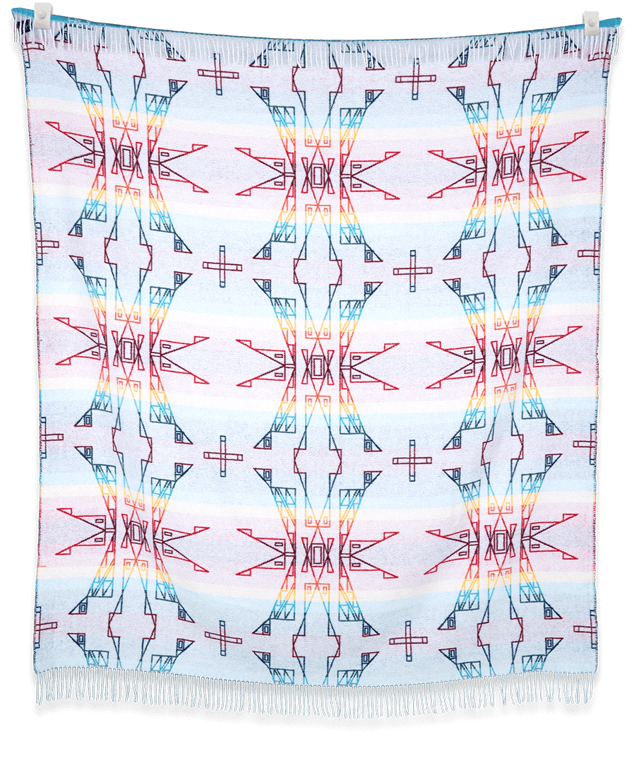 Colorful geometric patterned fabric hanging on a black background