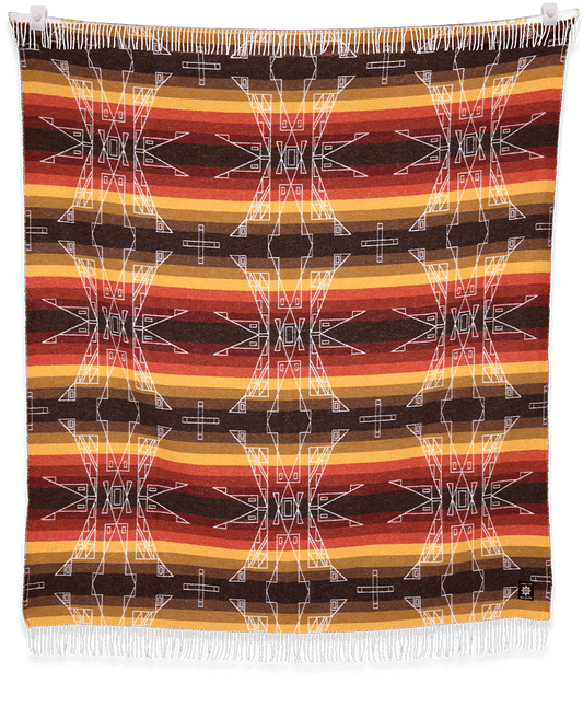 Woven blanket with geometric pattern and colorful stripes on a black background