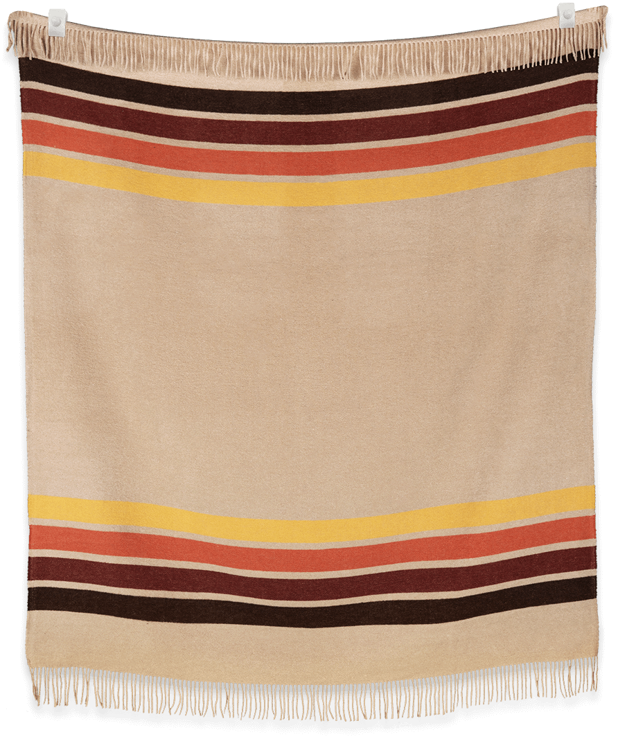 Beige blanket with multicolored stripes on a black background