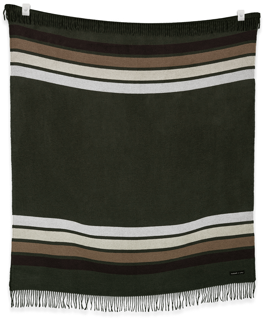 Striped blanket with fringes on a black background