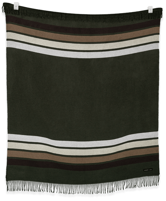 Striped blanket with fringes on a black background