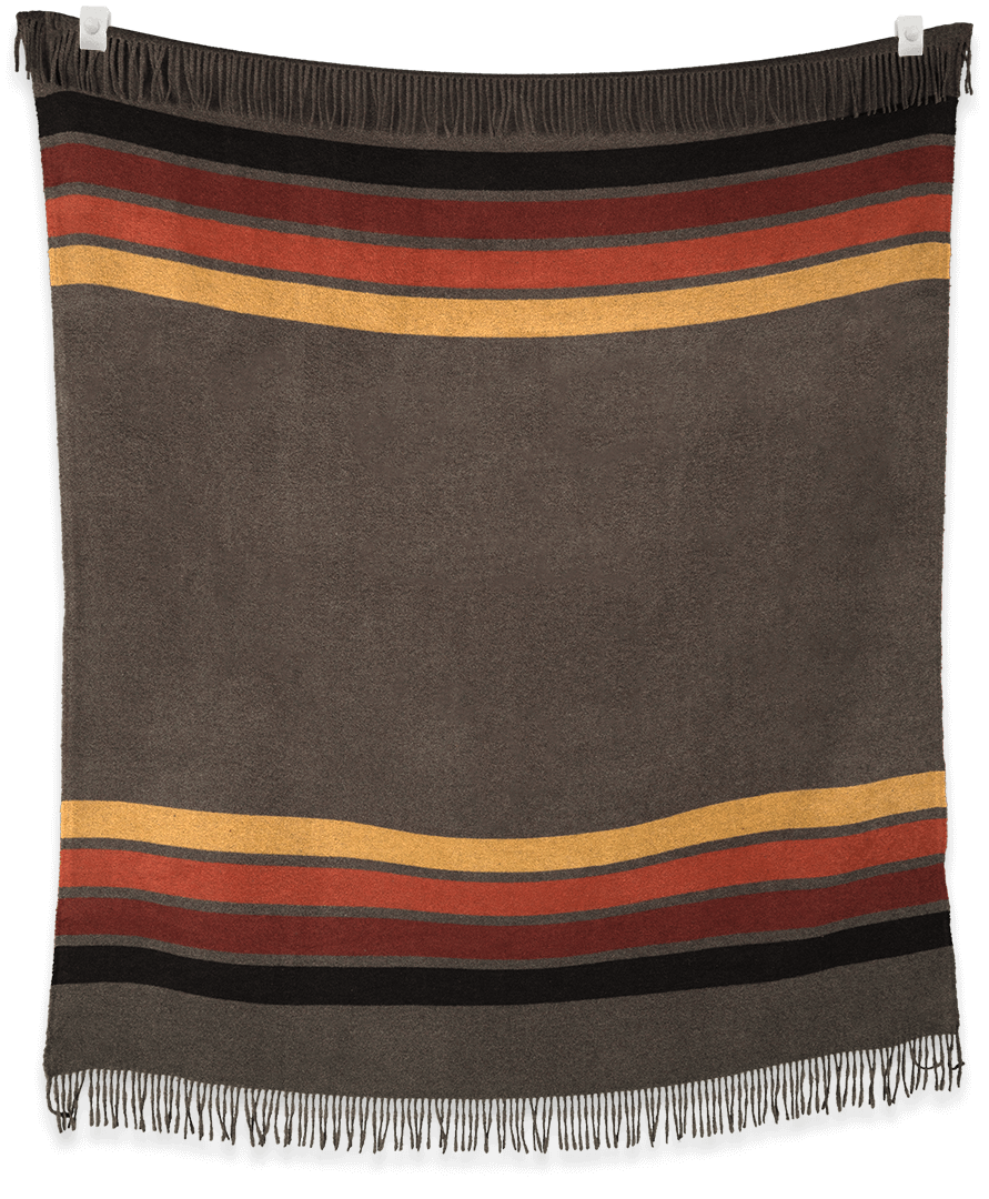 Striped blanket with brown, orange and yellow colors on a black background