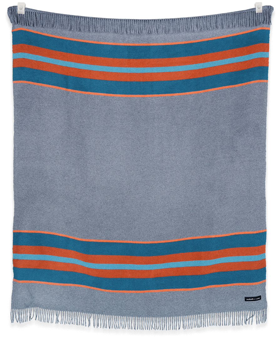 Striped blanket with blue and orange stripes on a black background