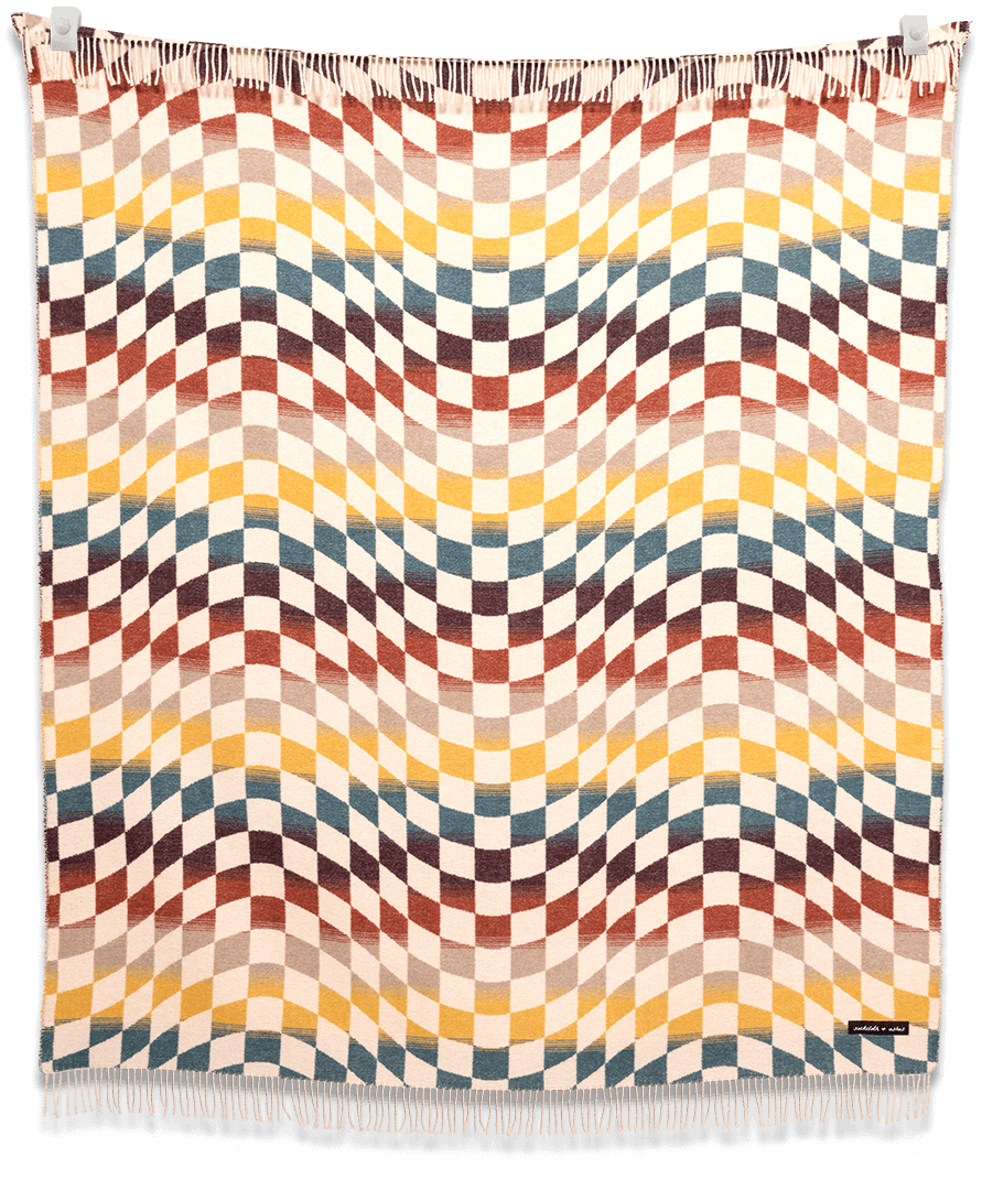 Blanket with a multicolored geometric pattern on a black background