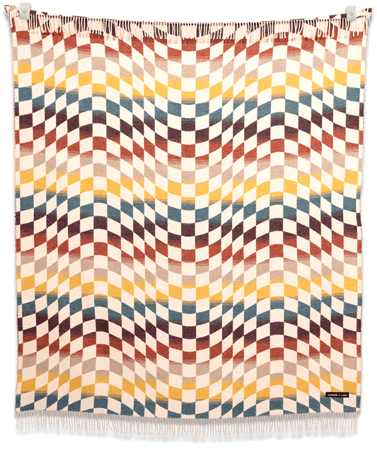 Blanket with a multicolored geometric pattern on a black background
