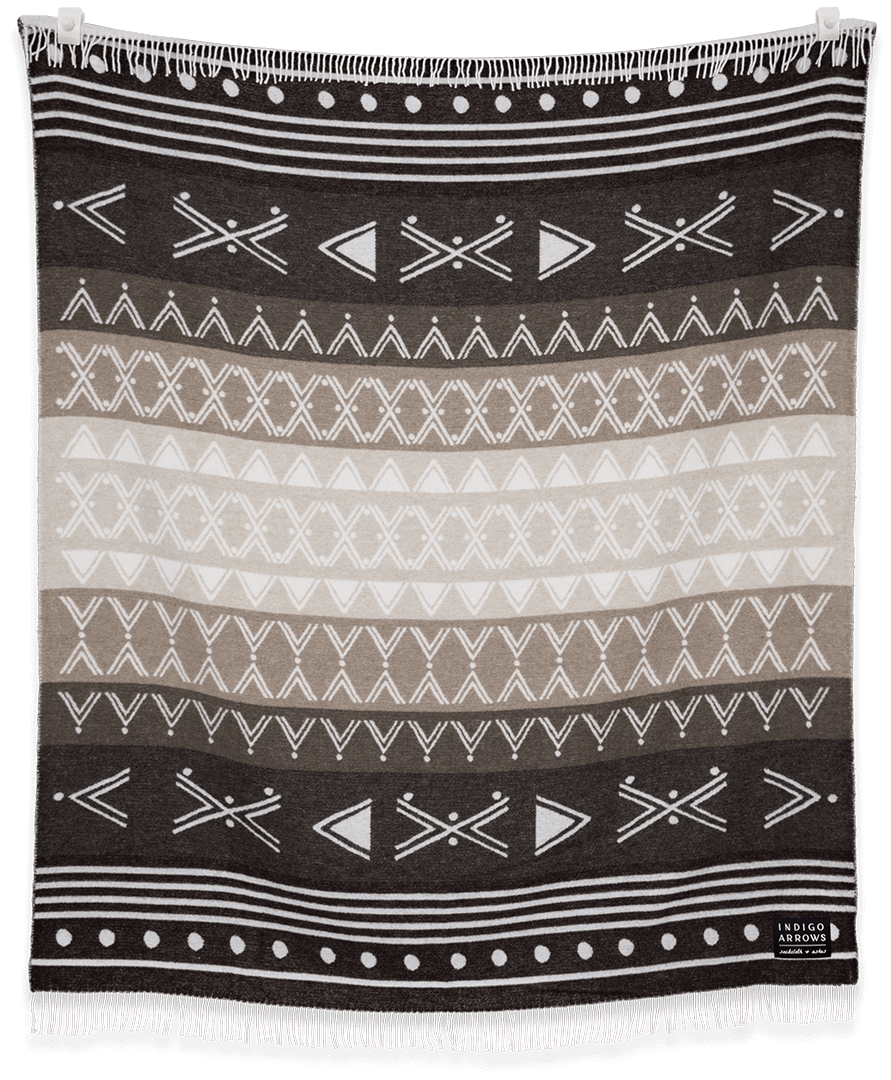 Black and white patterned blanket with geometric designs
