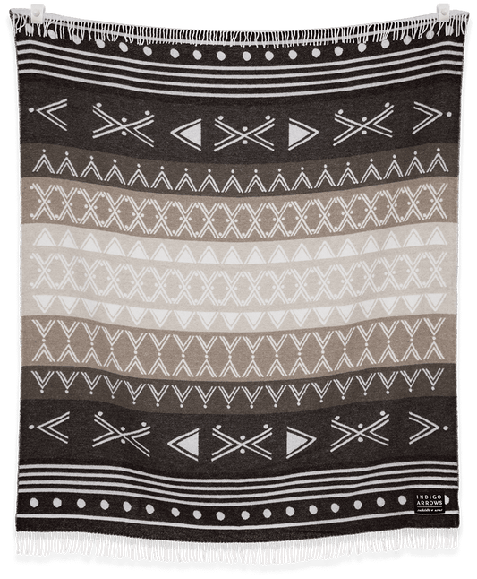 Black and white patterned blanket with geometric designs