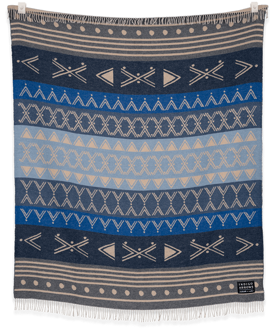 Woven blanket with geometric pattern on a black background
