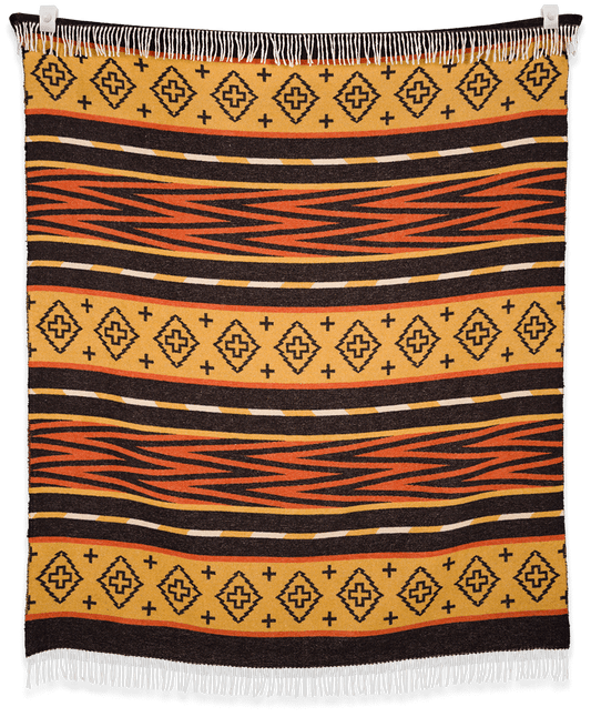 Woven blanket with geometric pattern on a black background