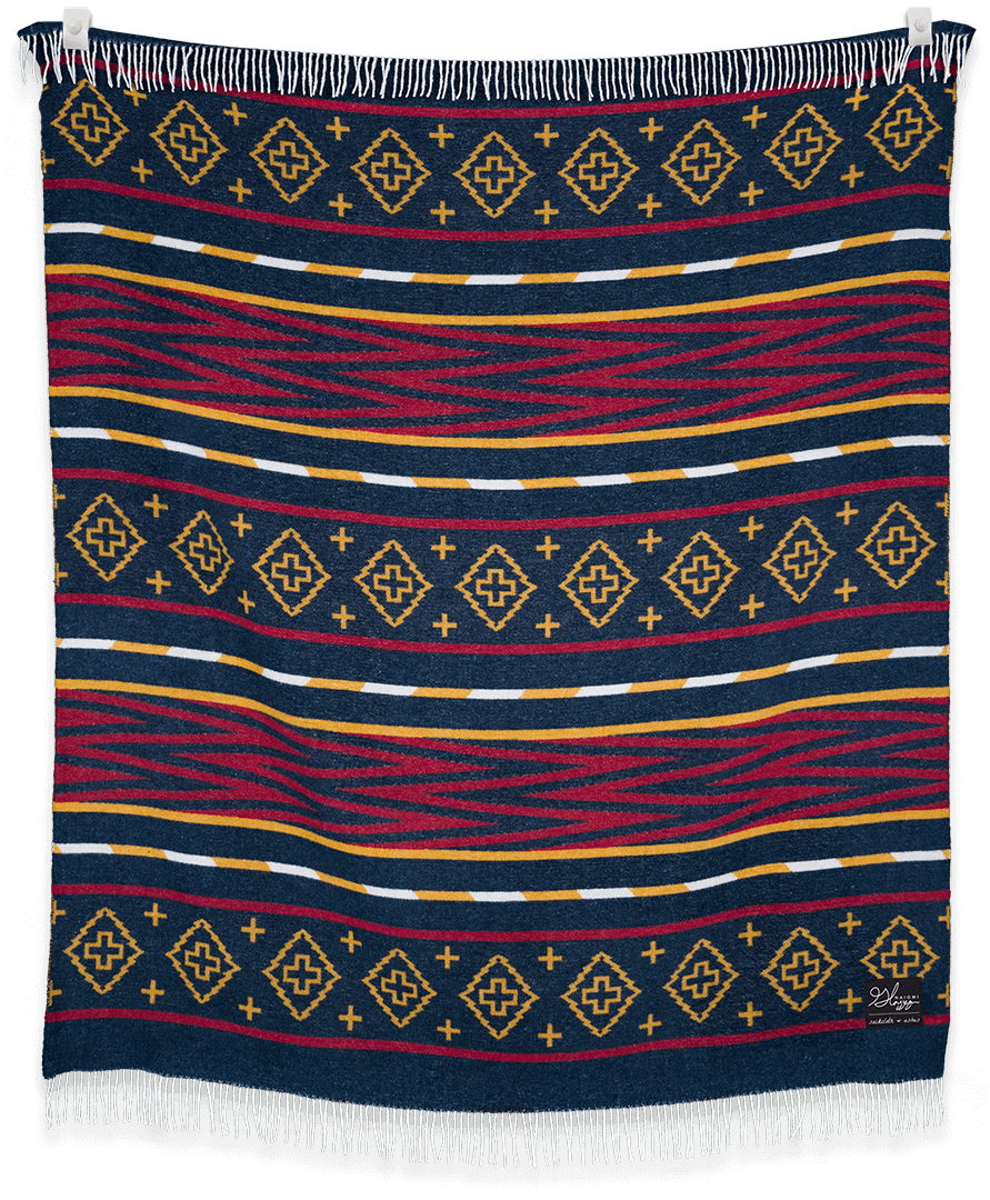 Woven blanket with geometric pattern on a black background