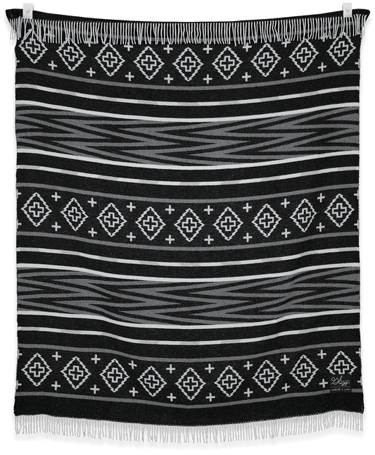 Black blanket with white geometric pattern