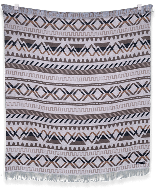 Patterned blanket with geometric design on a black background