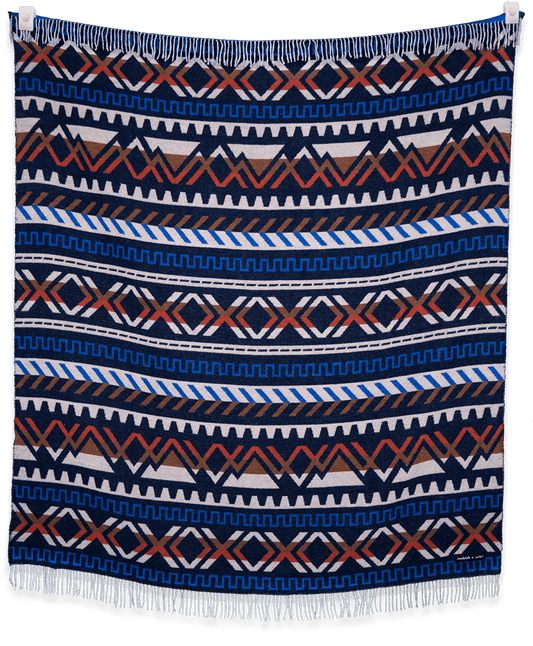 Patterned blanket with blue, white, and brown colors on a black background