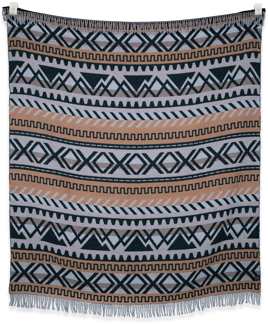 Woven blanket with geometric pattern on a black background