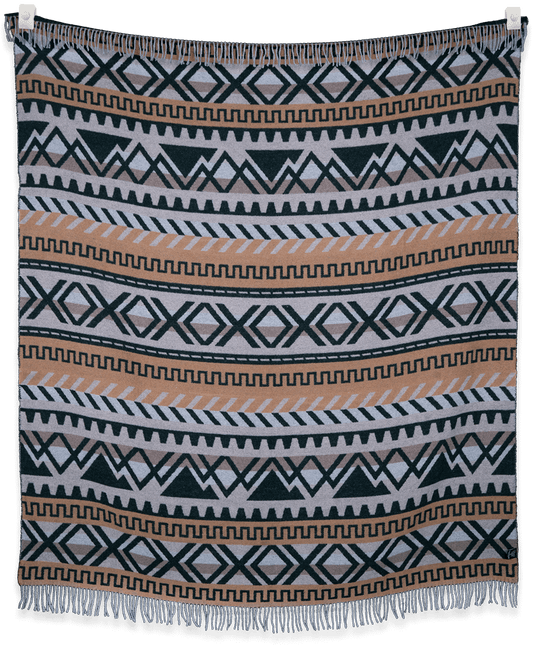 Woven blanket with geometric pattern on a black background