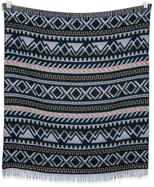 Patterned blanket with geometric design on a black background