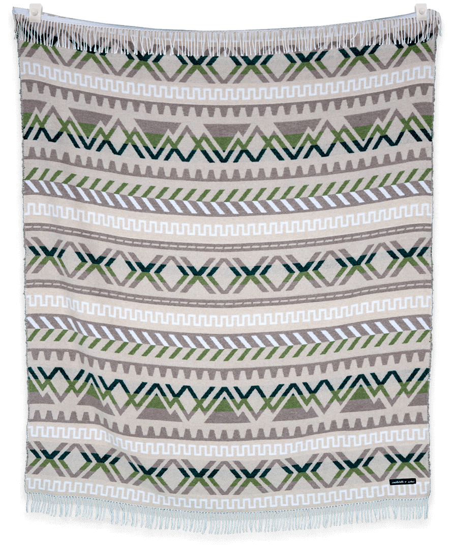 Woven blanket with geometric pattern on a plain background
