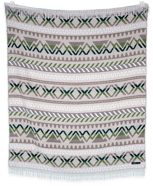 Woven blanket with geometric pattern on a plain background
