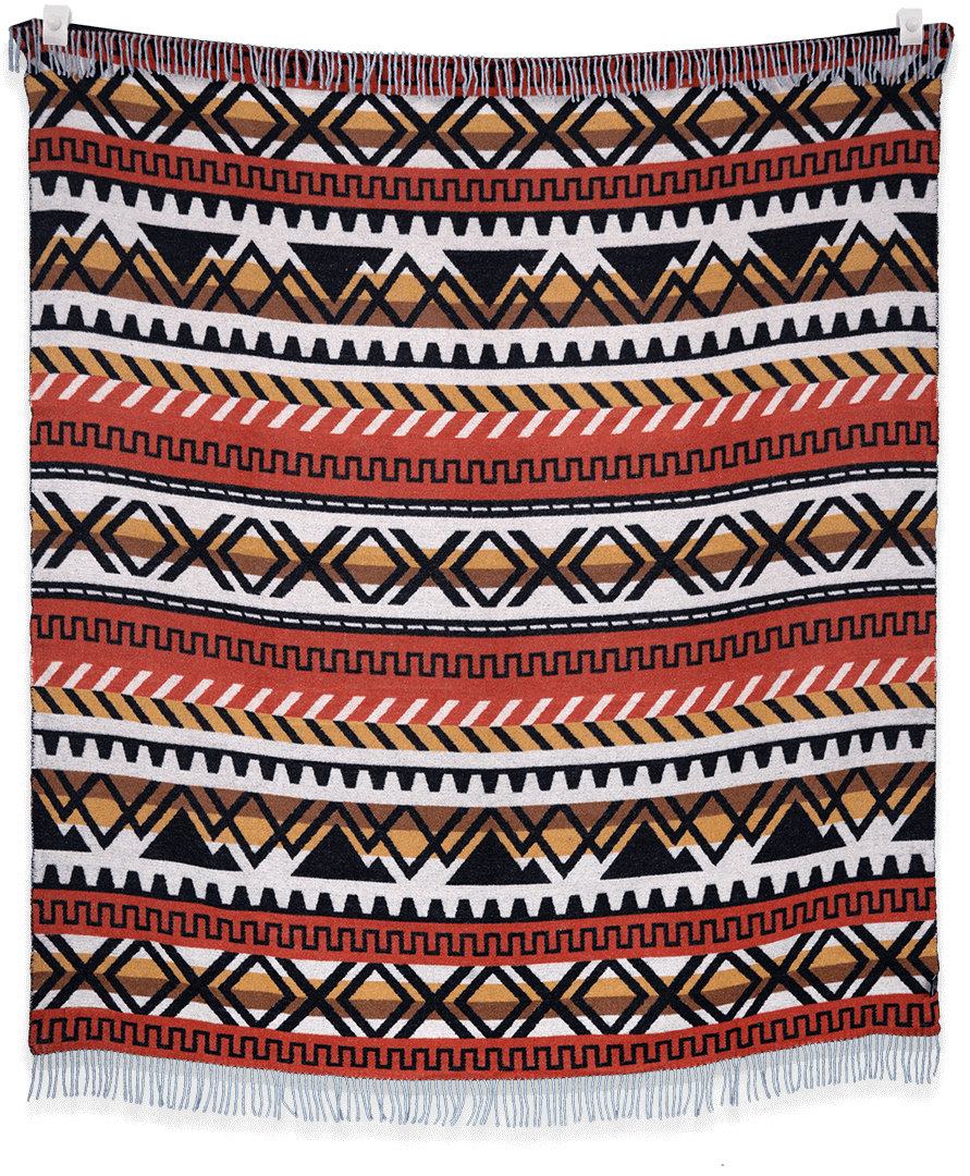 Patterned blanket with geometric design on a black background