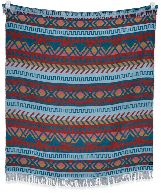 Woven blanket with geometric pattern on a black background