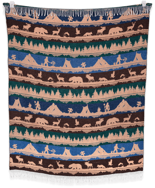 Woven blanket with Native American scene pattern on a black background