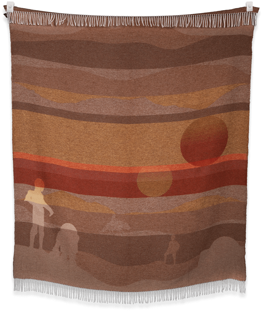 Woven blanket with abstract design of a person, dog, and landscape.