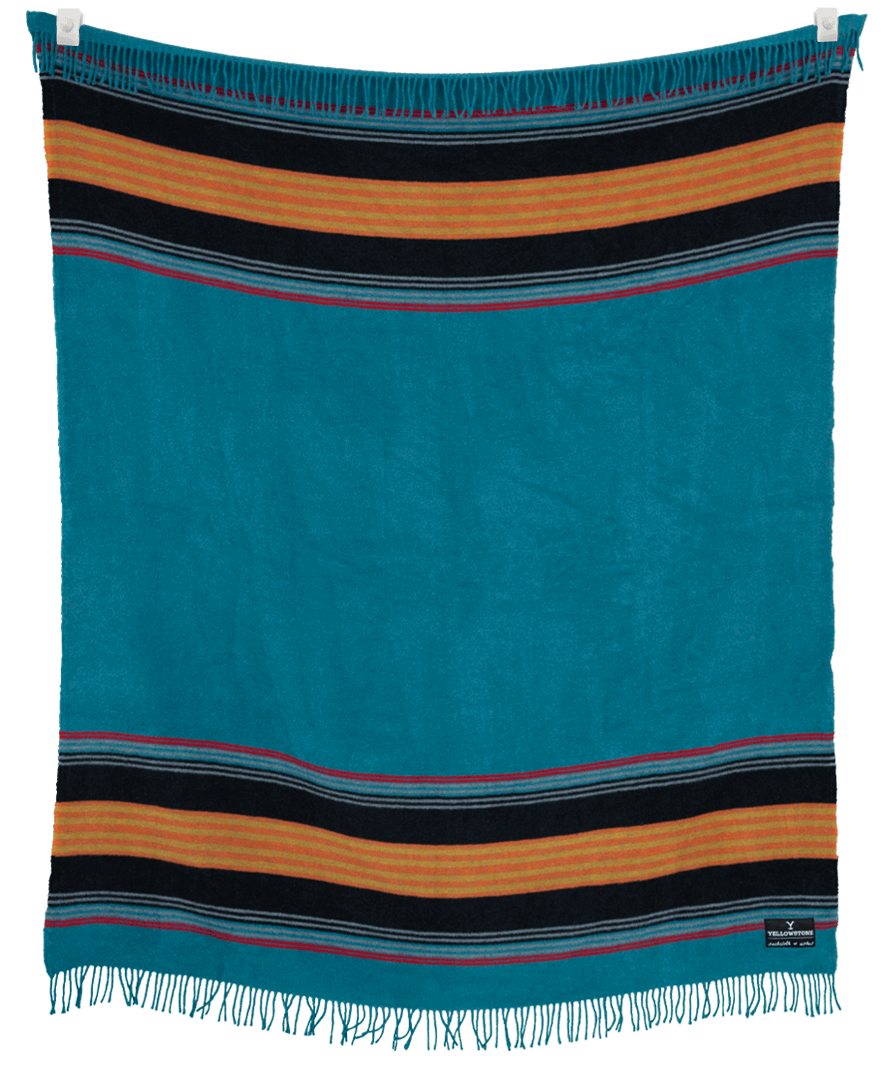 Striped blanket with blue, orange, and black colors on a black background