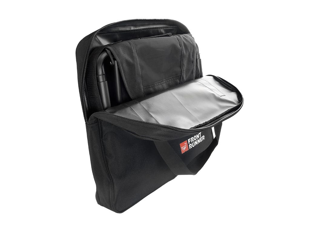 Black storage bag with open front compartment on a white background