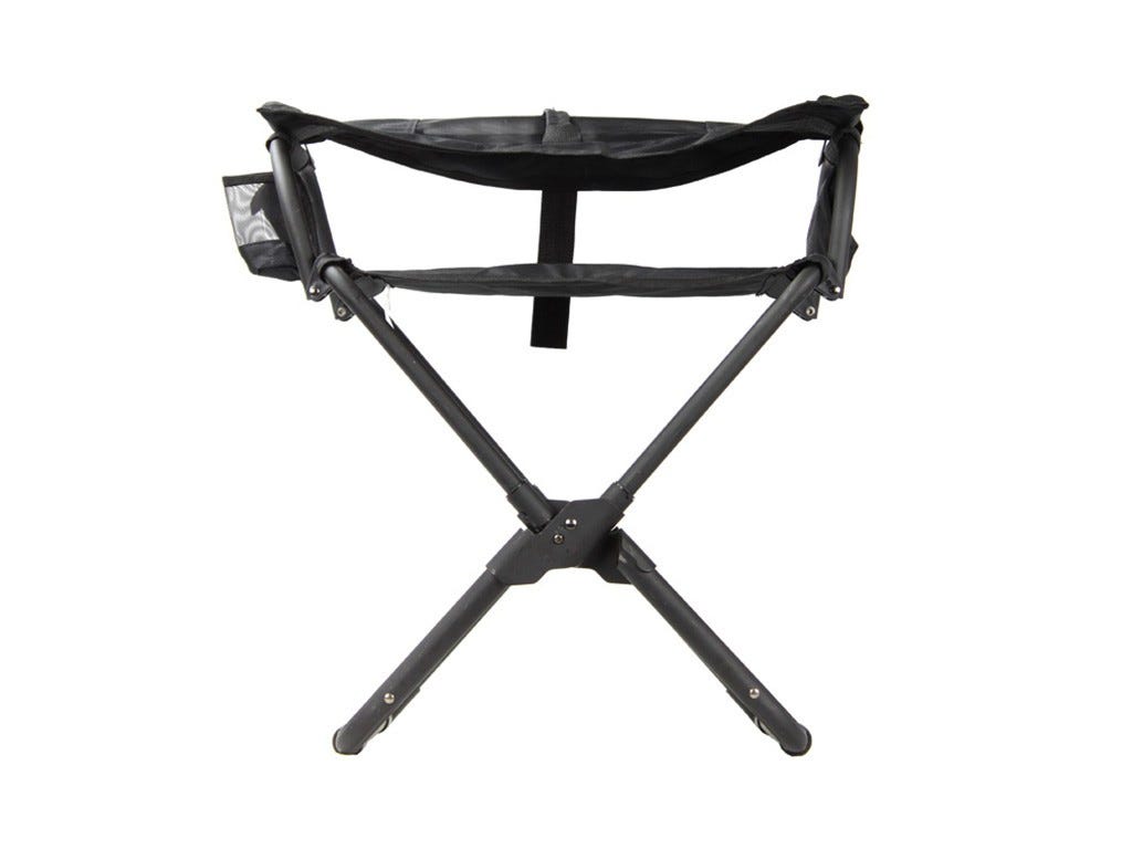 Black camping chair partially folded on a white background