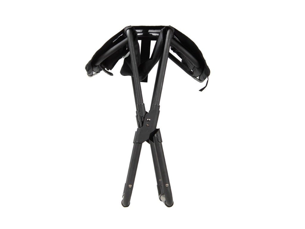 Black metal chair folded on a white background