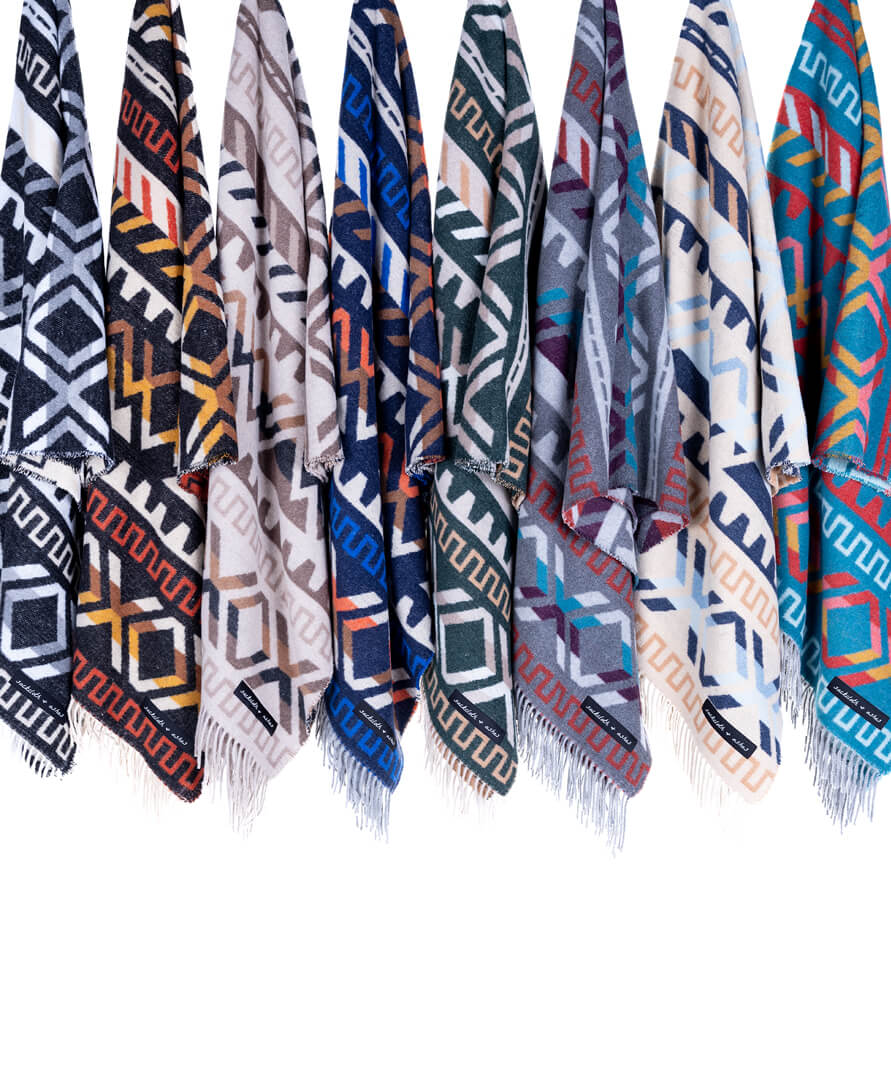Collection of patterned scarves with geometric designs on a white background